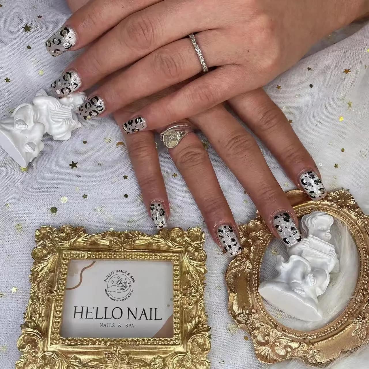 Cow print French tip nails