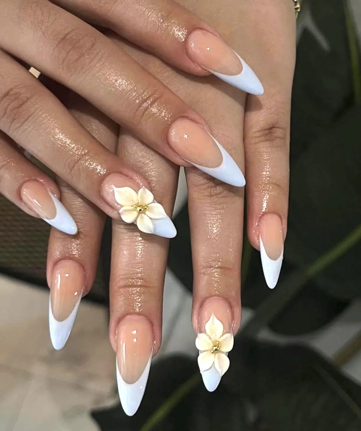 Almond nails with white French tips and 3D flower art at Hello Nails & Spa